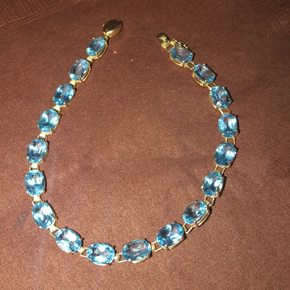 Blue topaz tennis bracelet 14kt yellow gold